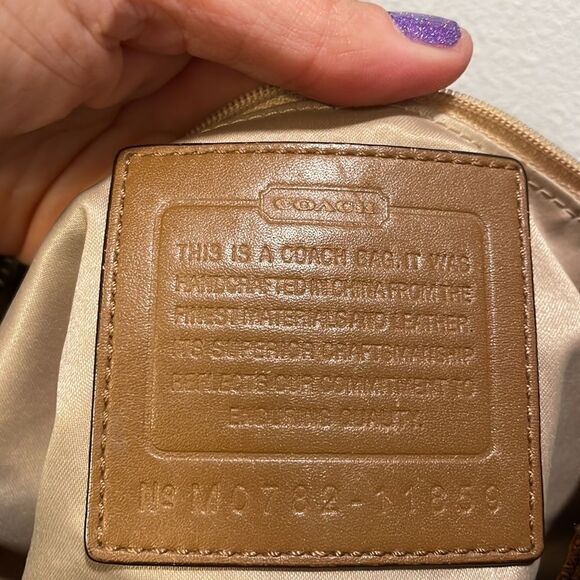 Coach woman’s brown canvas with twisted brown leather strap. - Picture 9 of 11